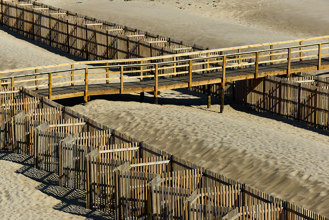 Wooden walkway and fence on the beach of the Atlantic, Odeceixe, Algarve, Portugal