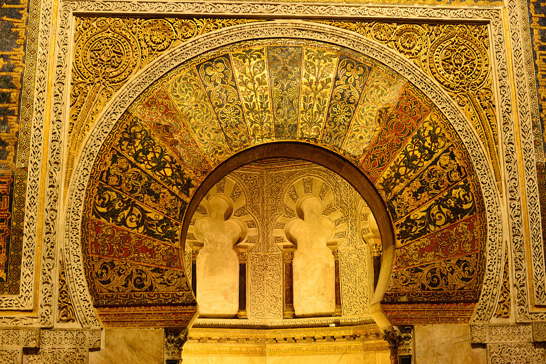 Golden ornate arch in the chamber of the Mosque-Cathedral, Cordoba, Andalusia, Spain