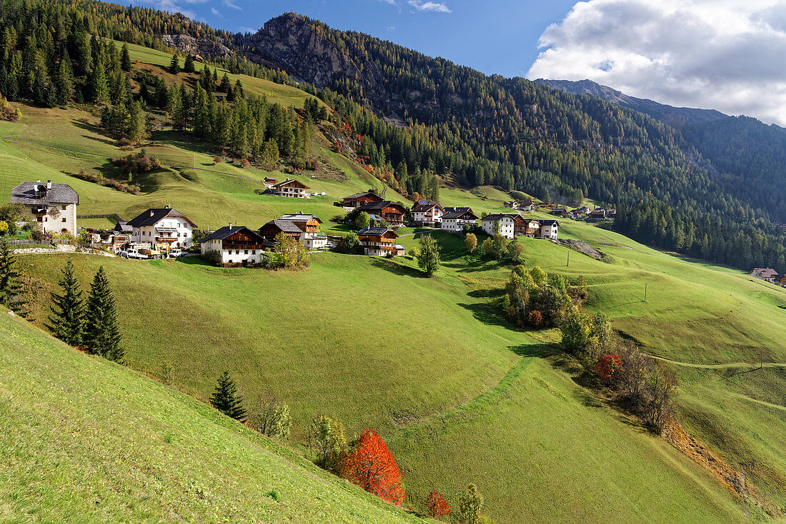Old farmsteads characterize the end of the Wengen valley in the Dolomites.