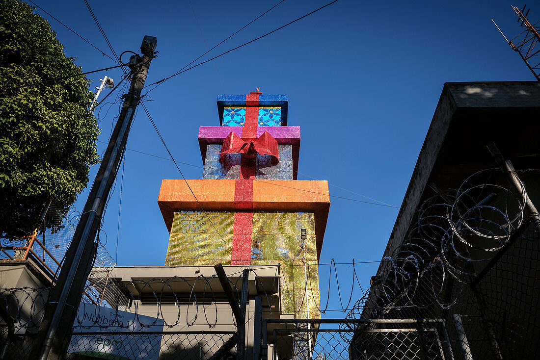 huge gift boxes behind barbed wire, Christmas decoration, Medellin, Colombia, South America