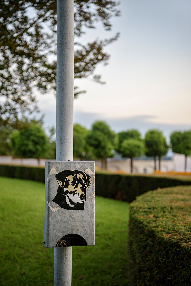 Station with dog poop bags in the castle gardens of Tettnang, Lake Constance, Baden-Wuerttemberg, Germany, Europe