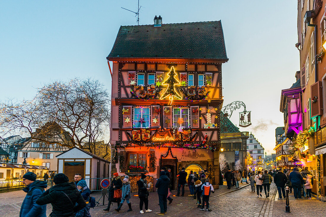 Old town decorated for Christmas with colorfully illuminated half-timbered houses, Colmar, Alsace, France