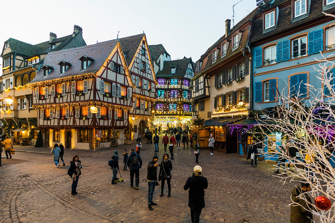 Old town decorated for Christmas with colorfully illuminated half-timbered houses, Colmar, Alsace, France