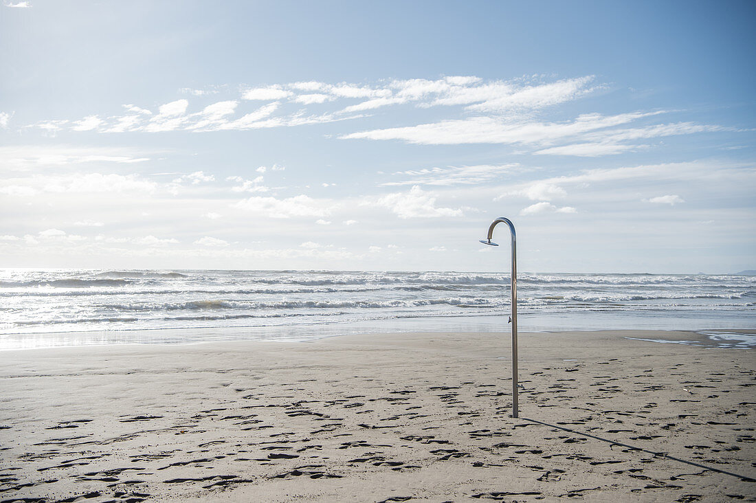 Shower in a deserted beach in winter, Forte die Marmi, Tuscany, Italy