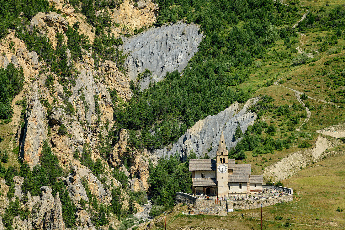 Church and erosion landscape of Cervieres at Col d´Izoard, Col d´Izoard, Cottian Alps, Hautes-Alpes, France