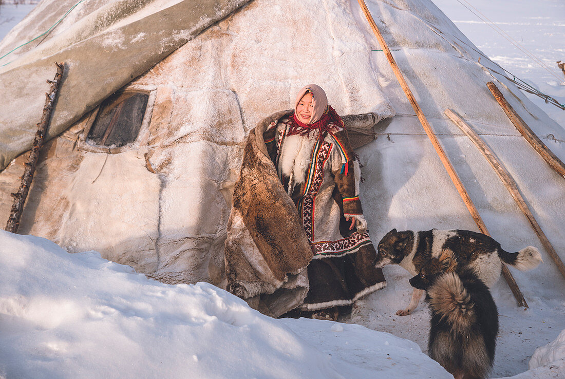 A young nenets girl. The traditional way of daily life at the nomadic reindeer herders camp. Polar Urals, Yamalo-Nenets autonomous okrug, Siberia, Russia