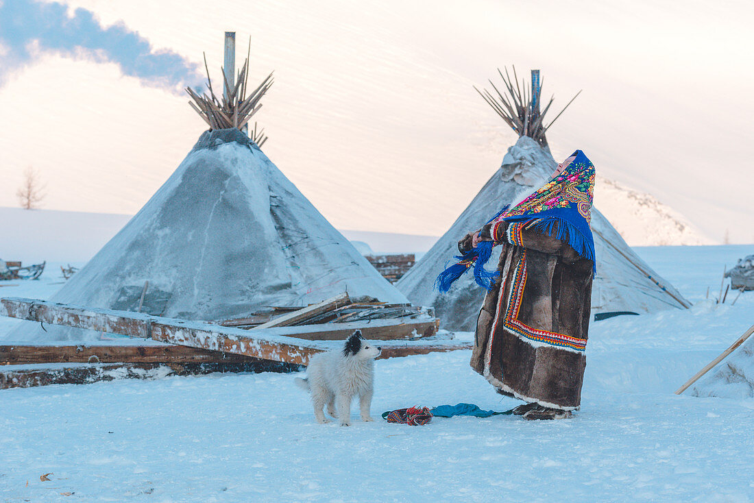Nenets woman dressed in the traditional way at the nomadic reindeer herders camp. Polar Urals, Yamalo-Nenets autonomous okrug, Siberia, Russia