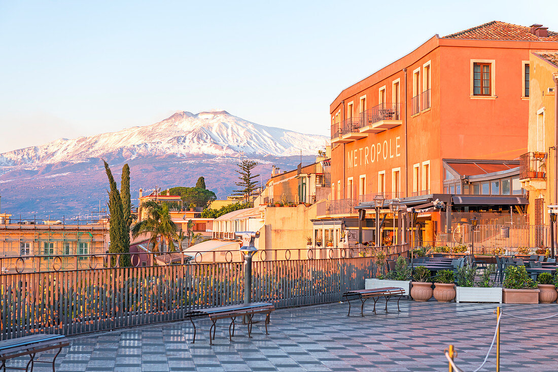 view of the Etna volcano from the square of Taormina. Europe, Italy, Sicily, Messina province, Taormina