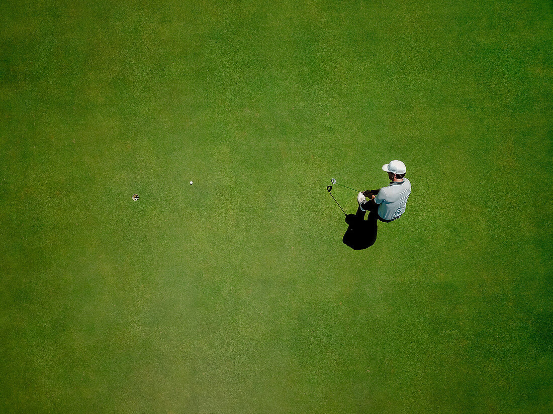 Man playing golf on golf course