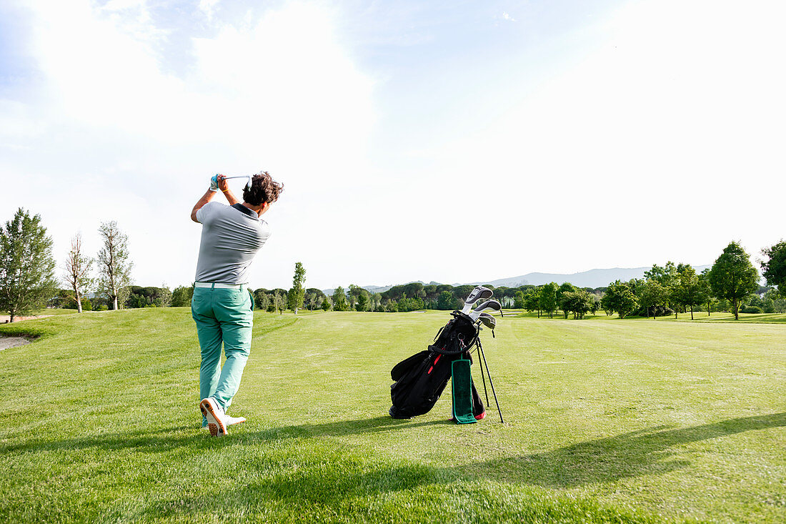 Man playing golf on golf course