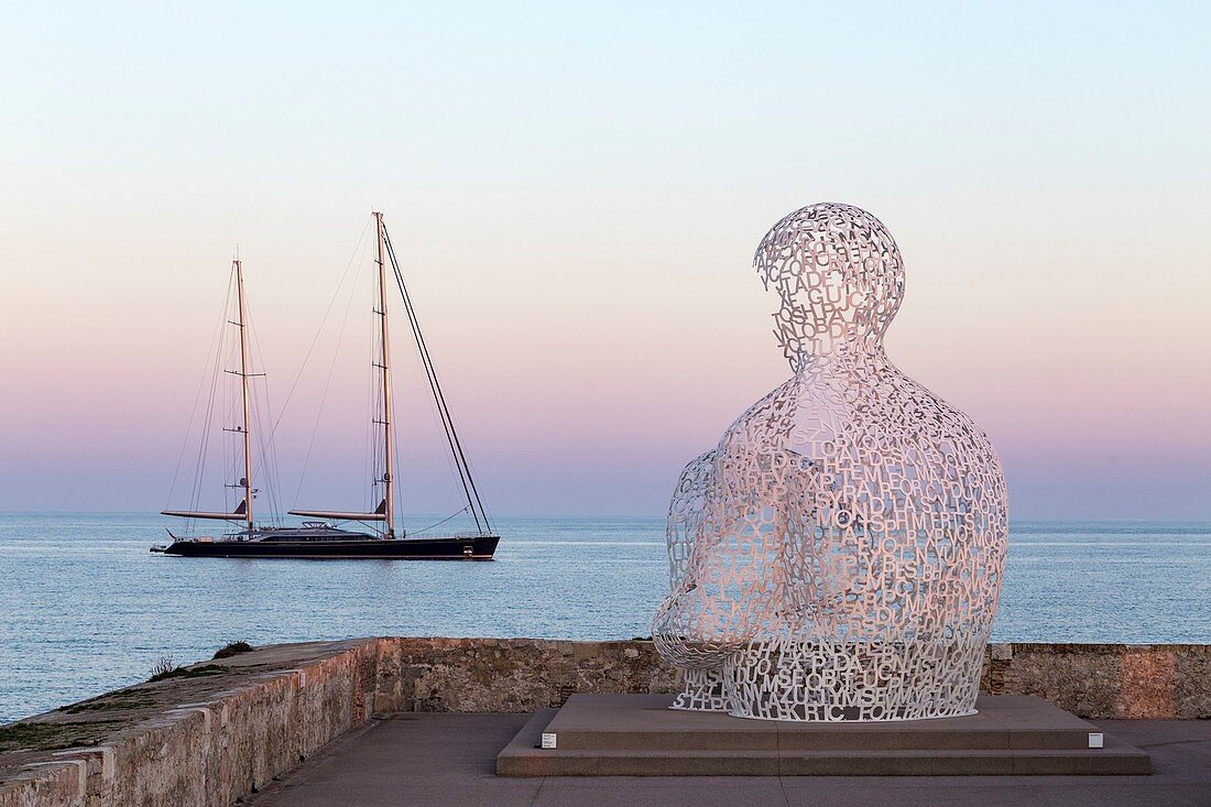 France, Alpes-Maritimes, Antibes, terrace of the bastion Saint-Jaume in the port Vauban, the transparent sculpture the "Nomad", created by the Spanish sculptor Jaume Plensa, the bust formed by letters