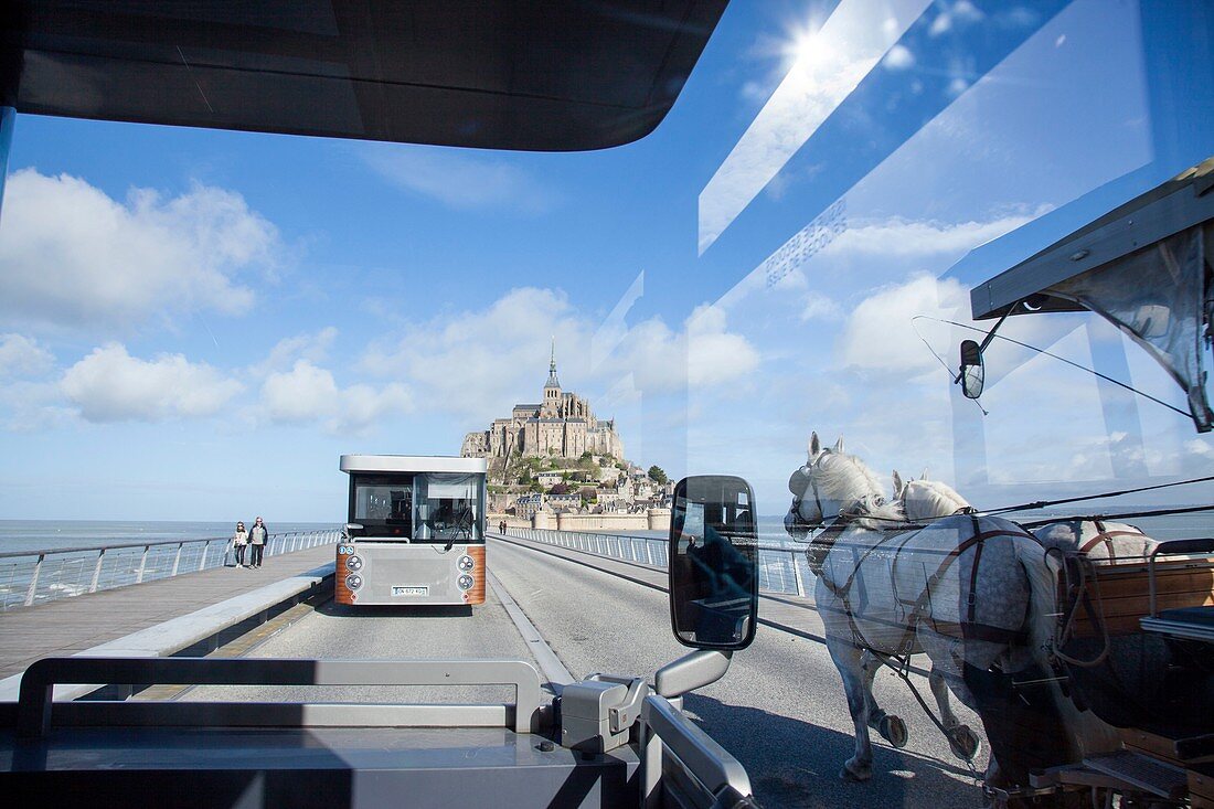 France, Manche, bay of Mont Saint Michel, listed as World Heritage by UNESCO, shuttle that takes visitors, but horse carriage
