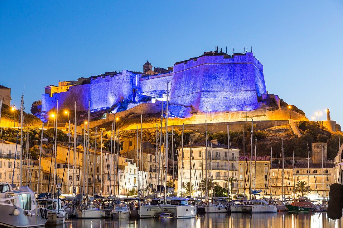 France, South Corsica, Bonifacio, the ramparts of the citadel floodlit seen since the port of the low city