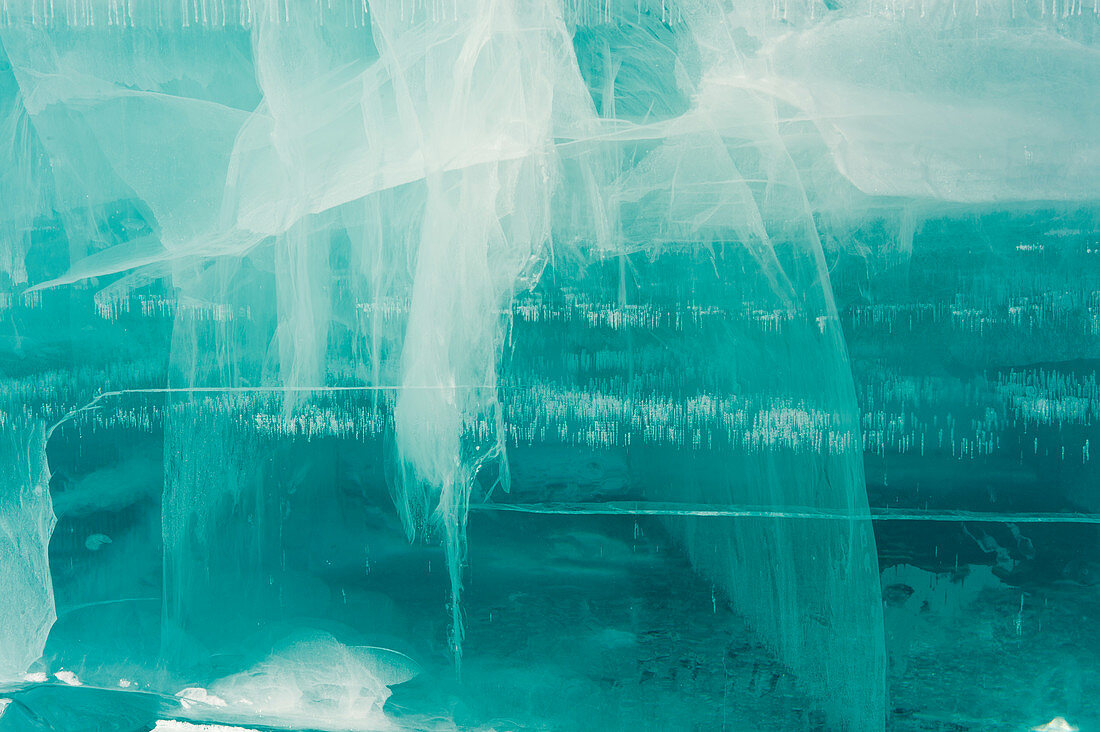 Close-up of a block of ice, looking into the inside at the structure with cracks and air bubbles, at the Icehotel in Jukkasjarvi near Kiruna in Swedish Lapland; northern Sweden.