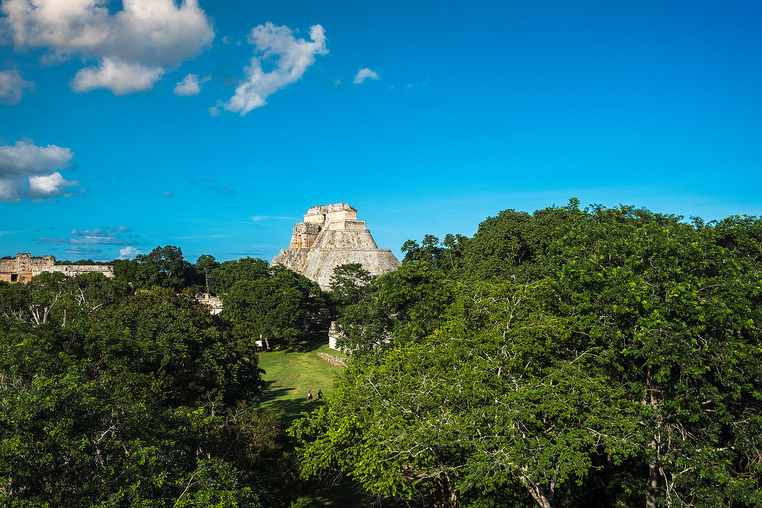 Uxmal, Yucatan, Mexico - October 13, 2017: The Pyramid of the Magician (Pirámide del Mago) towering in the Maya City of Uxmal, Mexico