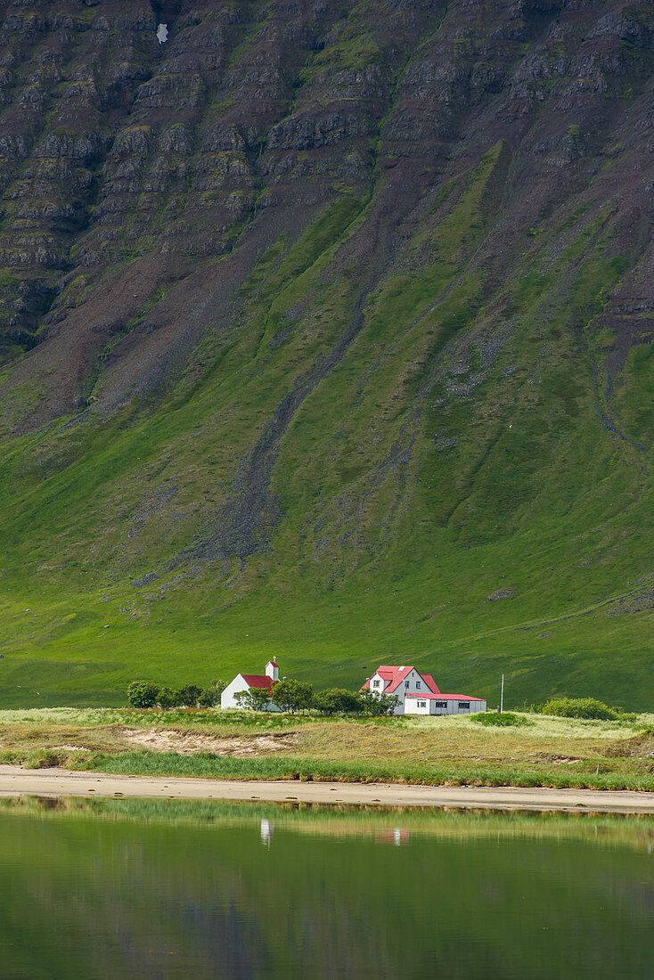 Church and farmland on Dyrafjordur, West fjords. Iceland.