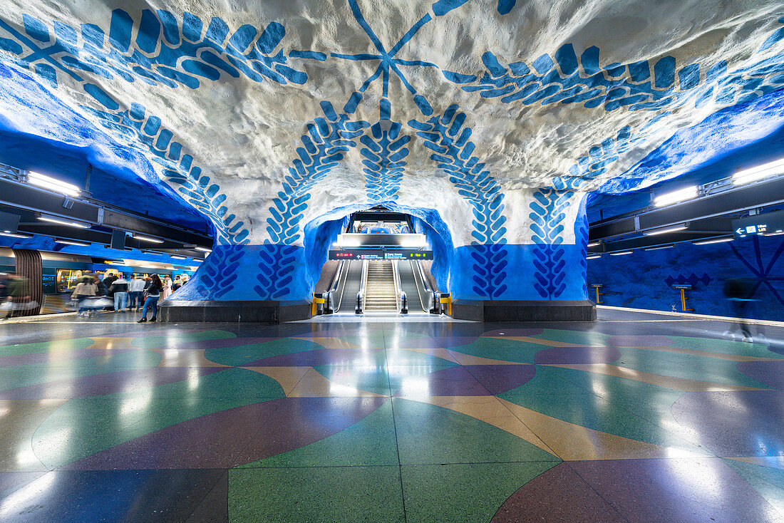 T-Centralen blue line metro station painted with blue stylized flowers and leaf creepers on rock walls, Stockholm, Sweden