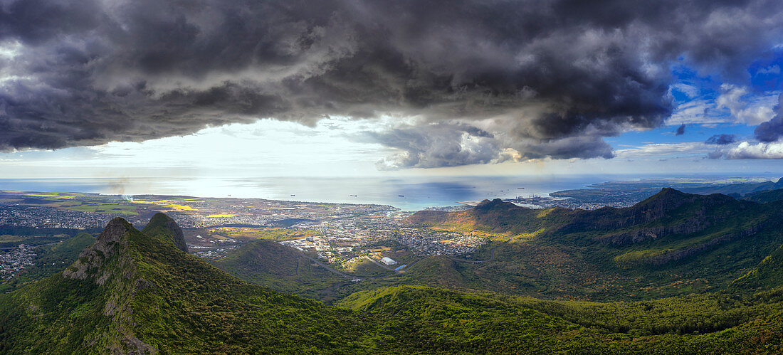 Storm clouds over Le Pouce mountain and Port Louis in background, aerial view, Moka Range, Mauritius