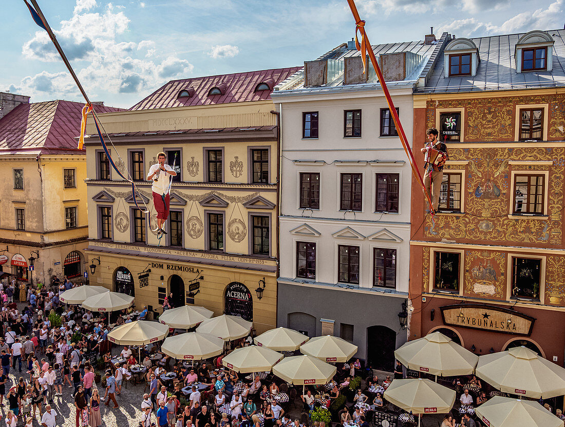 Musicians highlining over the Market Square, Old Town, Urban Highline Festival, Lublin, Lublin Voivodeship, Poland, Europe
