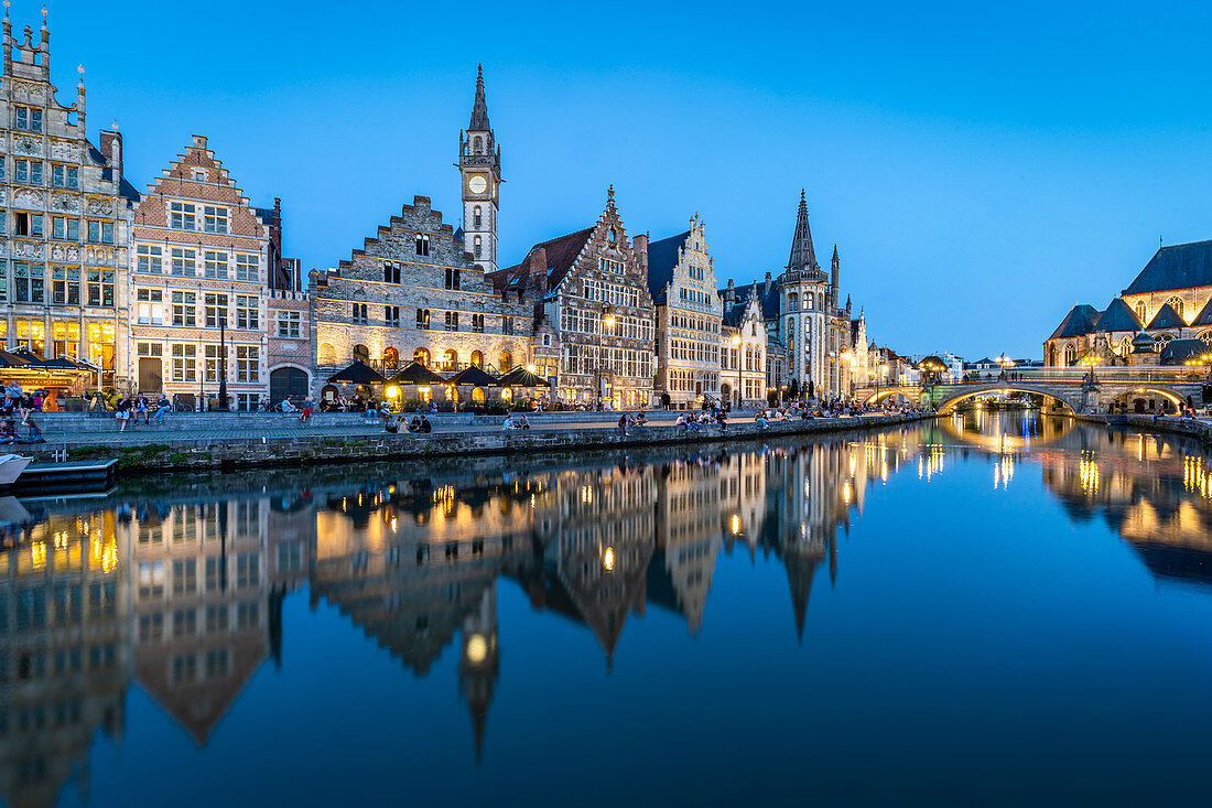 Graslei Quay in the historic city center of Ghent, mirrored in the River Lys during blue hour, Ghent, Belgium, Europe