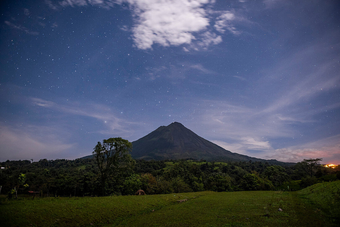 Arenal Volcano under stars at night, near La Fortuna, Alajuela Province, Costa Rica, Central America
