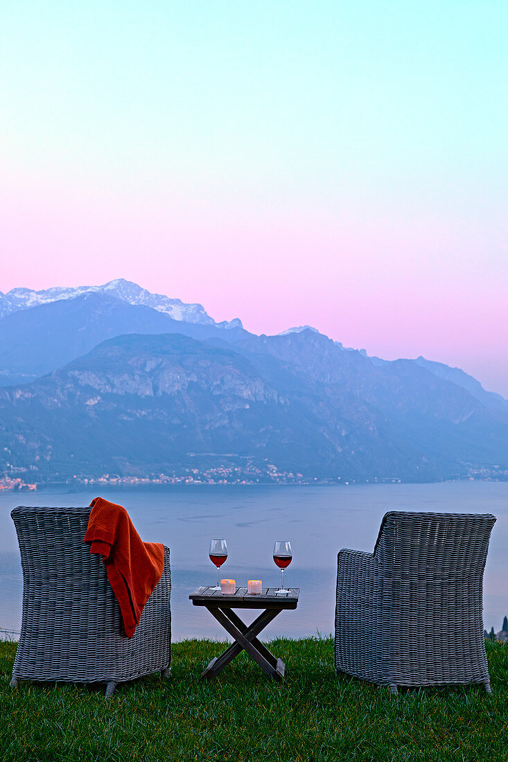 Armchairs and red wine with views of Lake Como at sunset, Lombardy, Italian Lakes, Italy, Europe