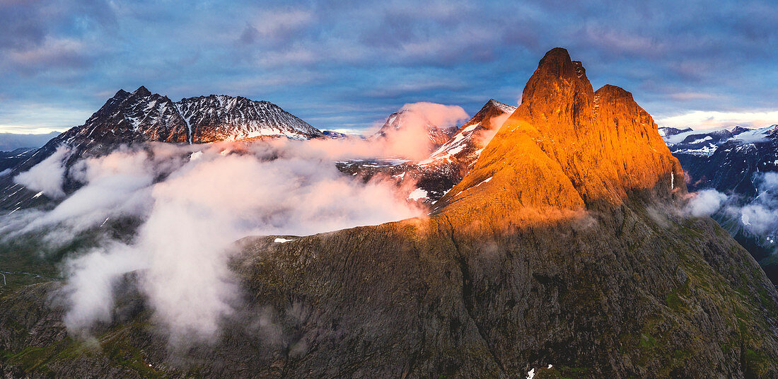 Aerial view of Romsdalshornet and Venjetinden mountain lit by sunset, Romsdalen valley, Andalsnes, More og Romsdal, Norway, Scandinavia, Europe