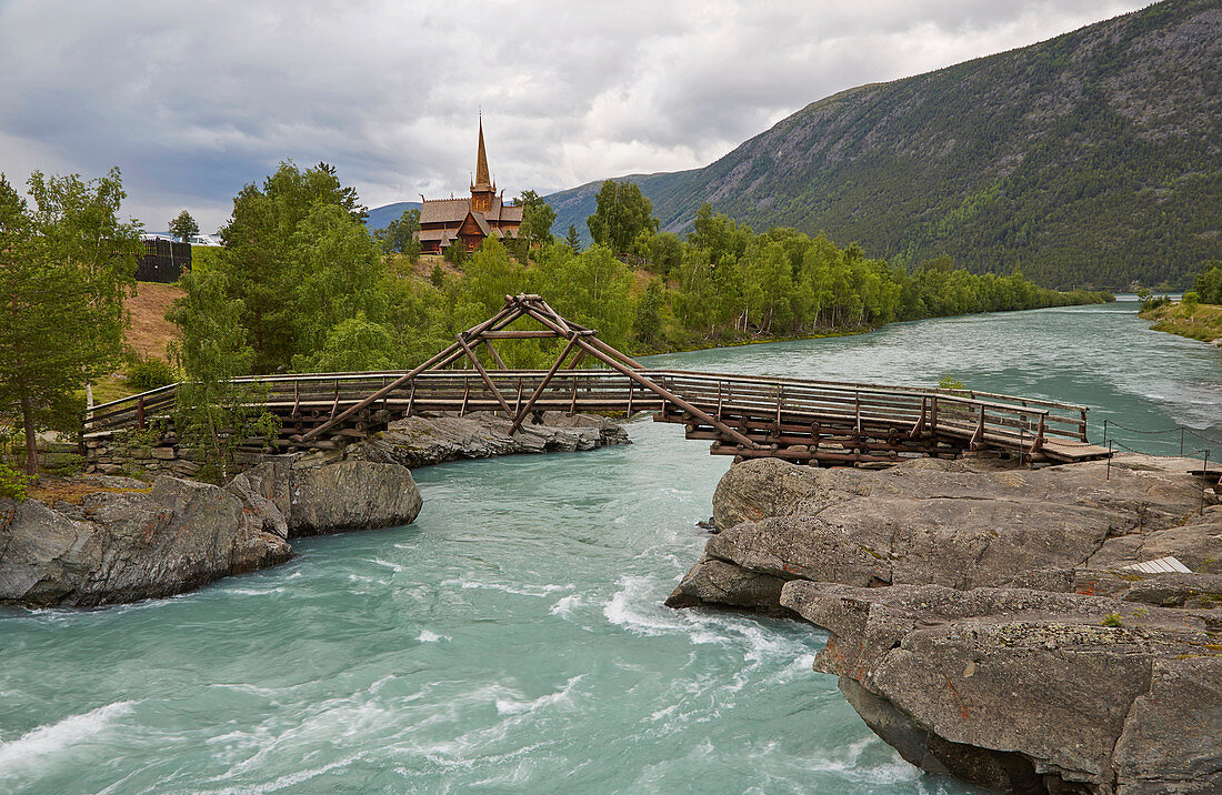 View over the Otta to Lom Stave Church, Stavkyrkje Lom, Lom, Oppland, Norway, Europe