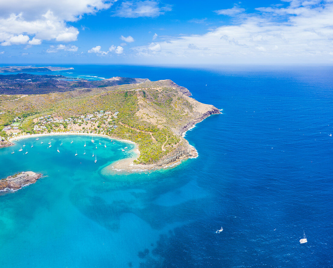 Aerial panoramic by drone of Galleon Beach and Pillar of Hercules limestone cliffs, Antigua, Antigua and Barbuda, Leeward Islands, West Indies, Caribbean, Central America