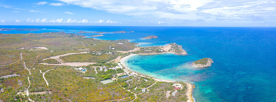 Aerial panoramic by drone of Caribbean Sea surrounding Exchange Bay, Antigua, Leeward Islands, West Indies, Caribbean, Central America