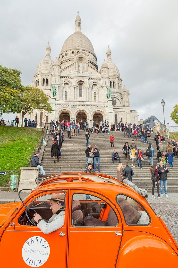 France, Paris, Montmartre, a 2CV in front of the Sacre Cœur