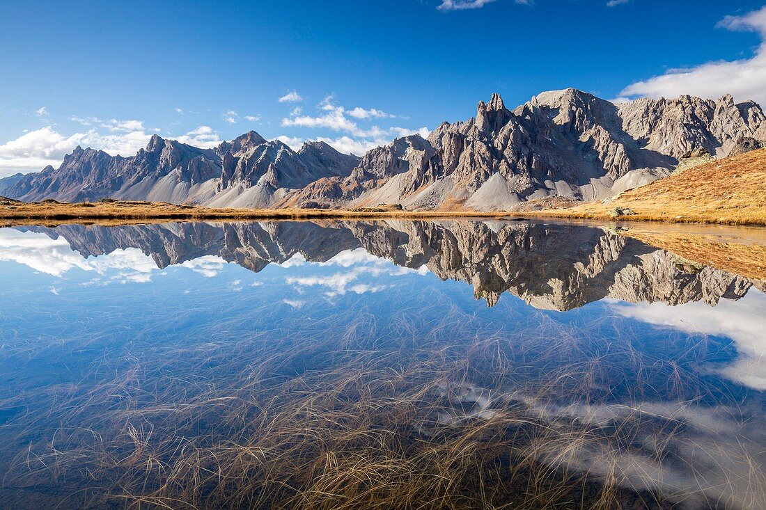 France, Hautes Alpes, Nevache, Claree valley, reflection of the massif des Cerces (3093 m) on an unnamed lake between Lakes Long and Round, to the right the ends of the Hand of Crepin (2942 m)