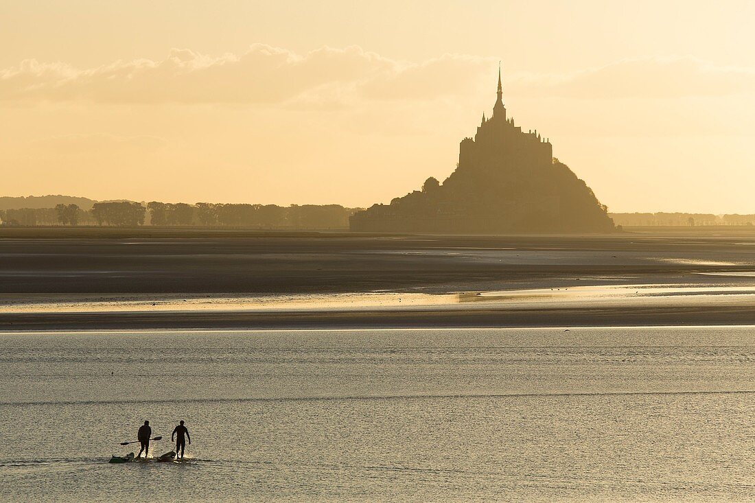 France, Manche, bay of Mont Saint Michel listed as World Heritage by UNESCO, sunset over Mont Saint Michel at high tide