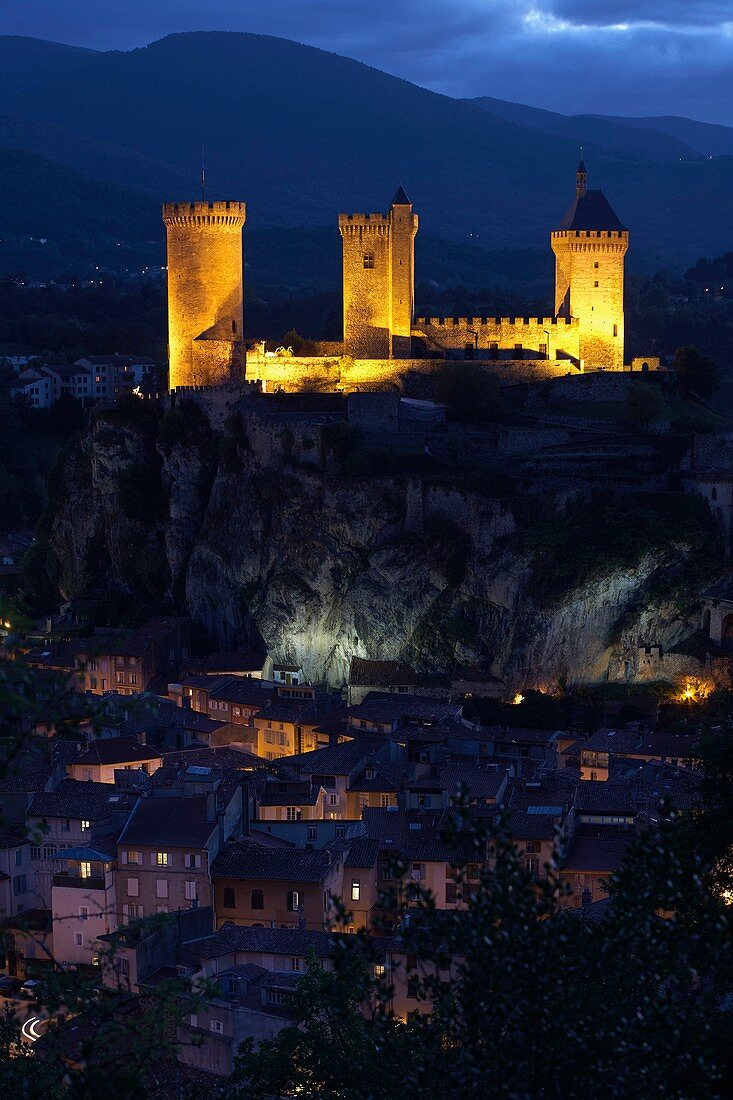 France, Ariege, Foix, Contal castle of Gaston Febus and counts of Foix overlooking the city, illuminations at nightfall