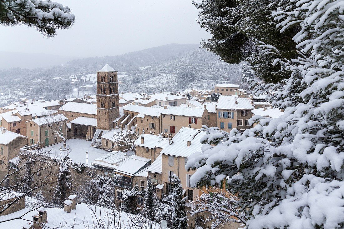 France, Alpes de Haute Provence, regional natural reserve of Verdon, Moustiers Sainte Marie, certified the Most beautiful Villages of France, the village and the Notre Dame de l'Assomption church during a snowfall
