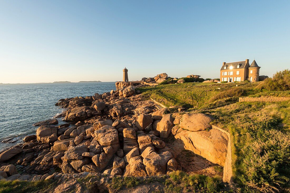 France, Cotes d'Armor, Perros Guirec, the lighthouse of Ploumanac'h or lighthouse Mean Ruz and the coast of Granit Rose at sunset