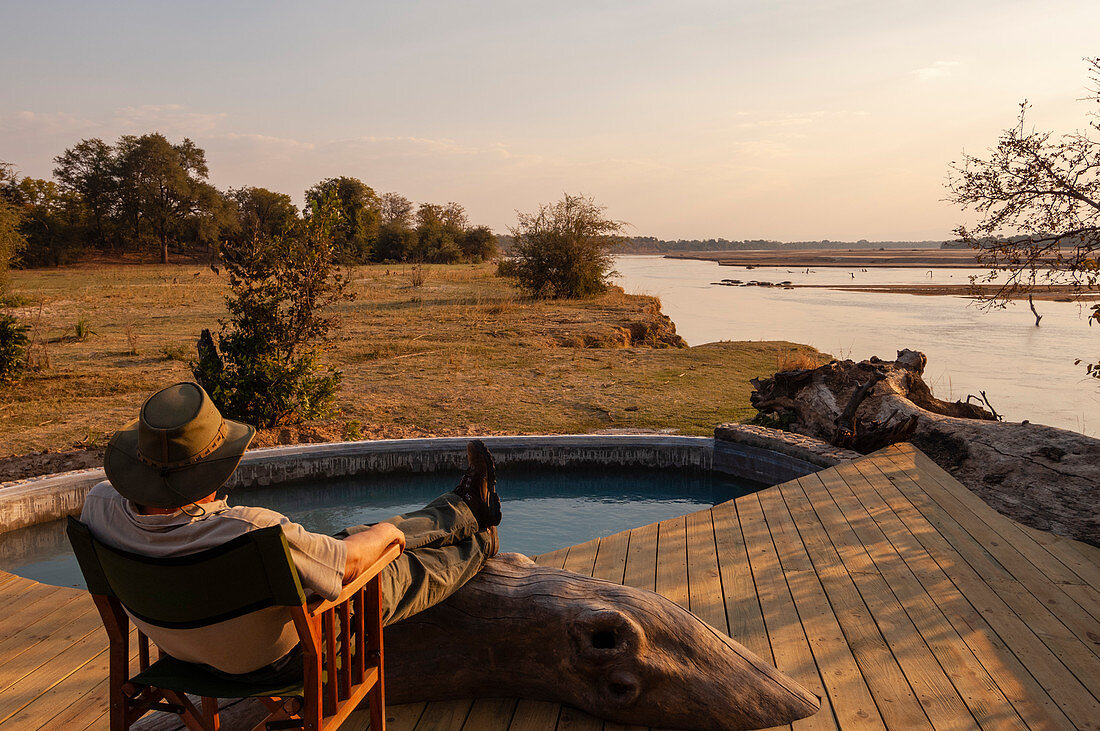 Traveller relaxing at Kalamu Tented Camp,South Luangwa National Park,Zambia