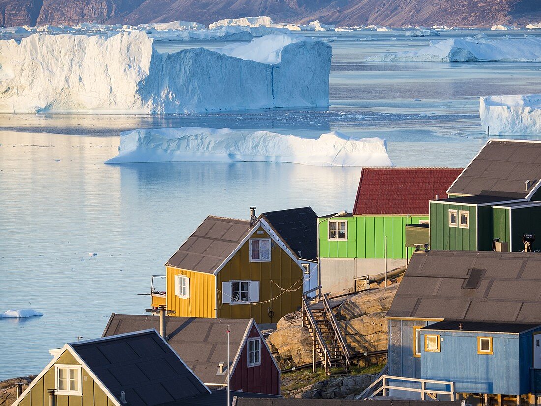 View of fjord full of icebergs towards Nuussuaq (Nugssuaq) peninsula during midnight sun. The town Uummannaq in the north of West Greenland, located on an island  in the Uummannaq Fjord System. America, North America, Greenland