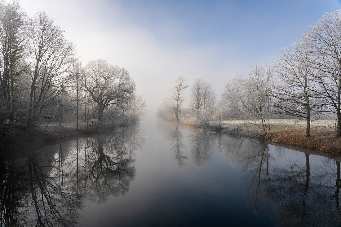 Winter idyll at the Kochelsee spout of the Loisach, Bavaria, Germany.