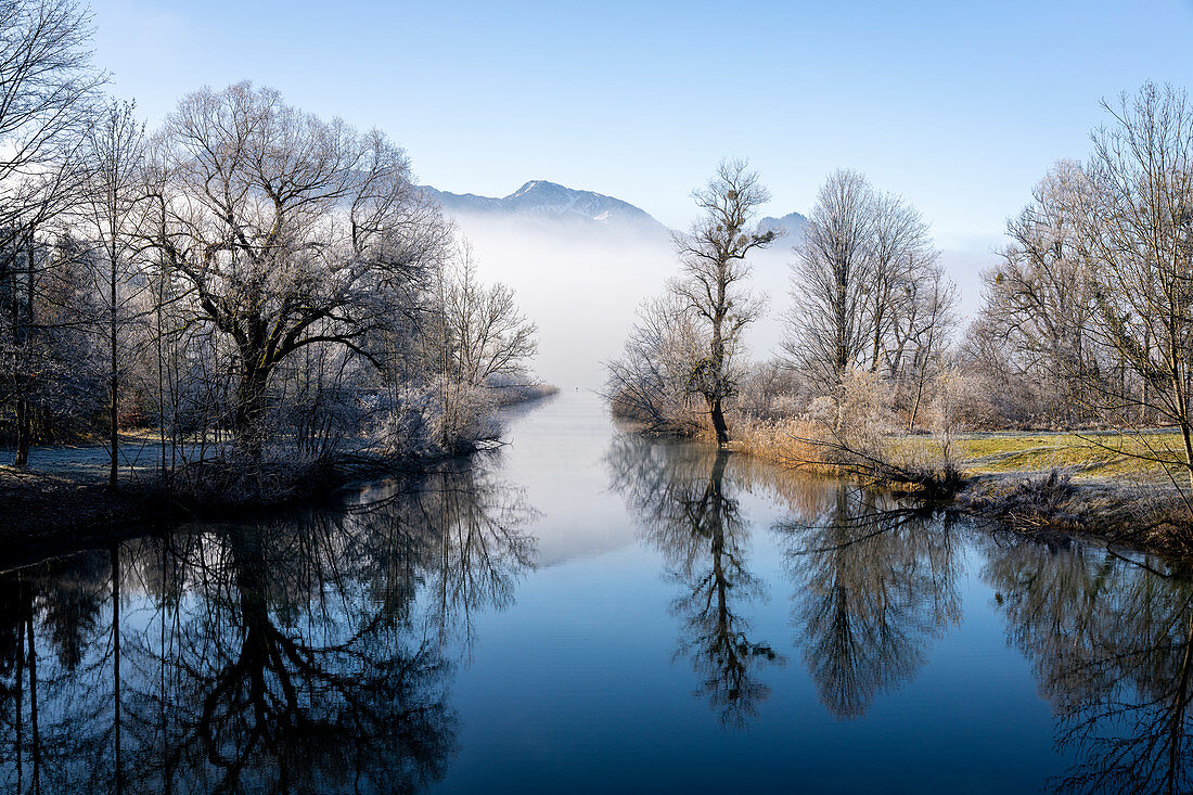 Winter idyll at the Kochelsee spout of the Loisach, Bavaria, Germany.