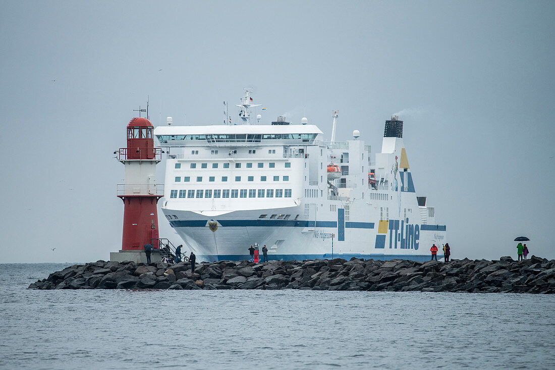 Cruise ship in front of lighthouse at the port of Rostock, Germany, Mecklenburg-Western Pomerania, Baltic Sea