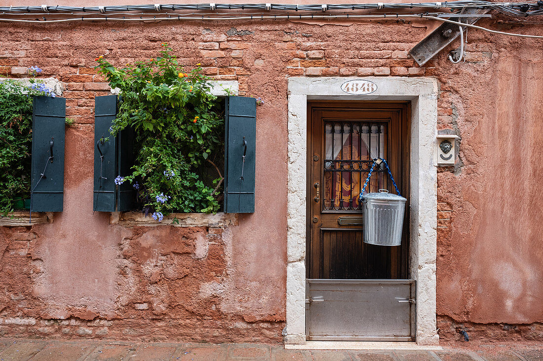 View of a facade with entrance door in San Marco, Venice, Veneto, Italy, Europe