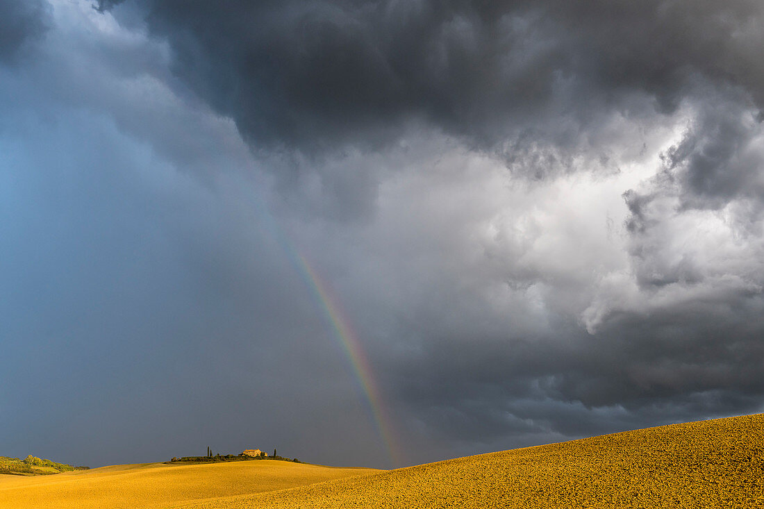 Rainbow and thunderstorm mood in Val d'Orcia, Tuscany, Italy