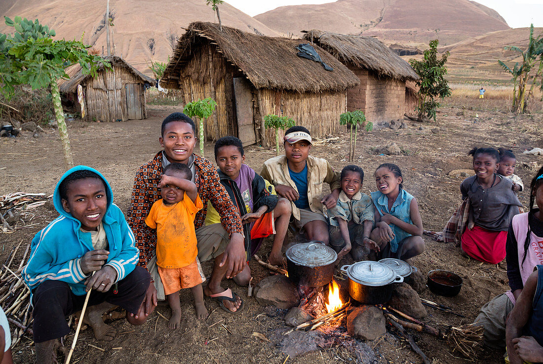 Family by the evening fire, near Ampefy, Merina tribe, highlands, Madagascar, Africa