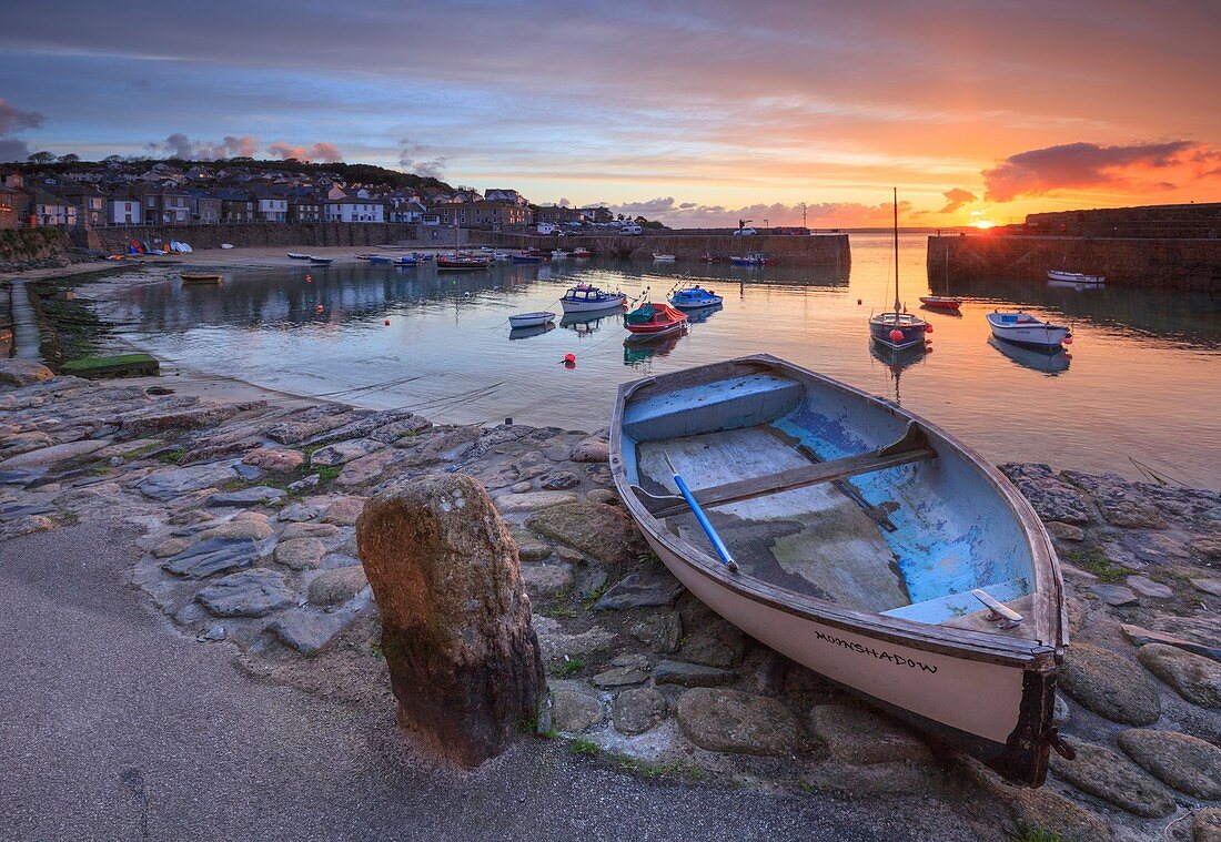 Boats at picturesque Mousehole harbour, in the west of Cornwall.  Captured from the harbour side, at sunrise in late April.