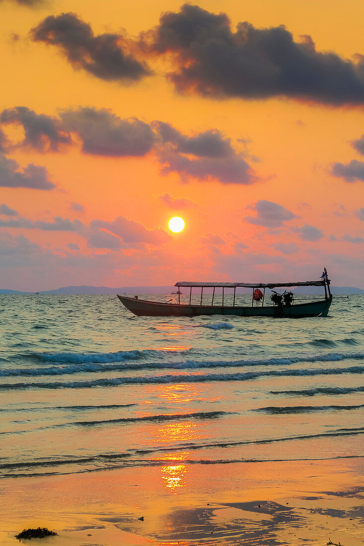 Fishing boat moored off beach south of the city at sunset, Otres Beach, Sihanoukville, Cambodia, Indochina, Southeast Asia, Asia