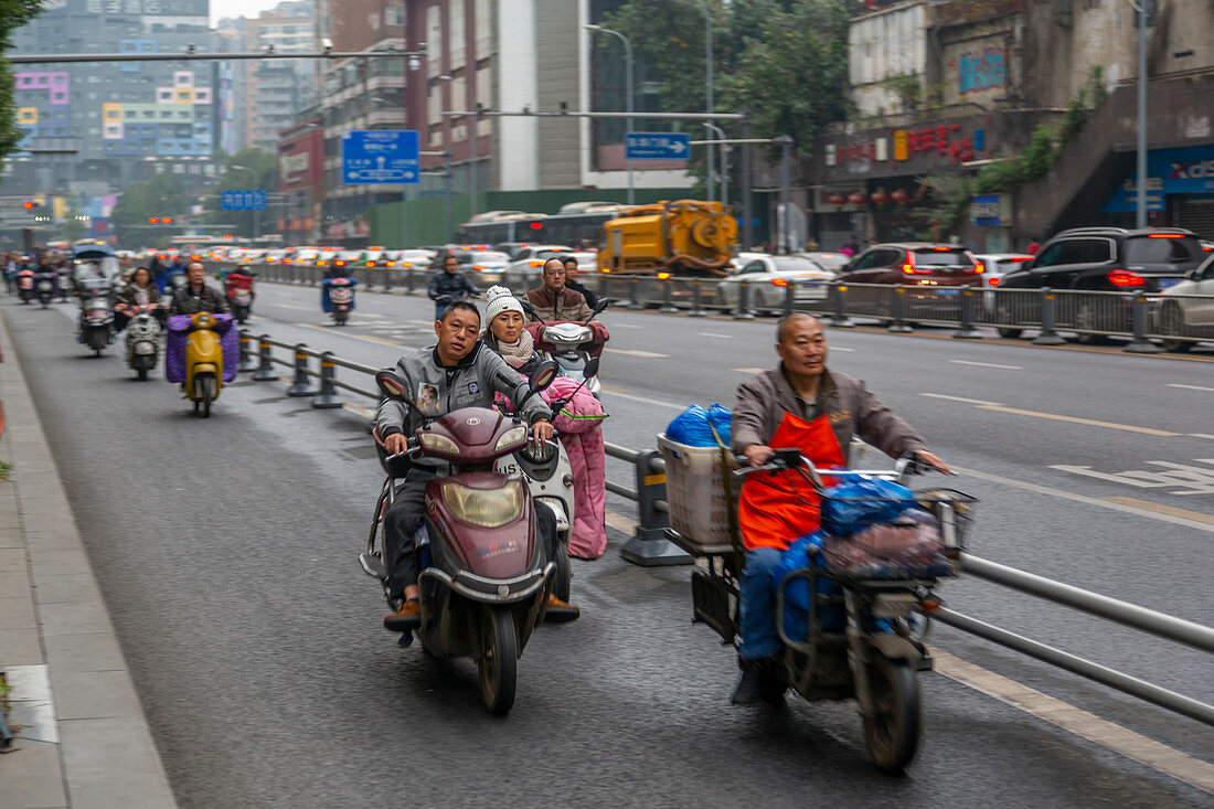 View of motor cyclists in Xi'an city centre, Xi'an, Shaanxi Province, People's Republic of China, Asia