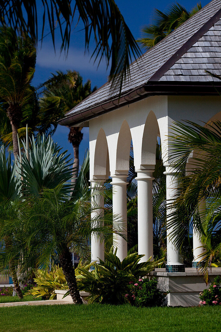 Columned facade of a colonial style house in a tropical setting, in Antigua, West Indies
