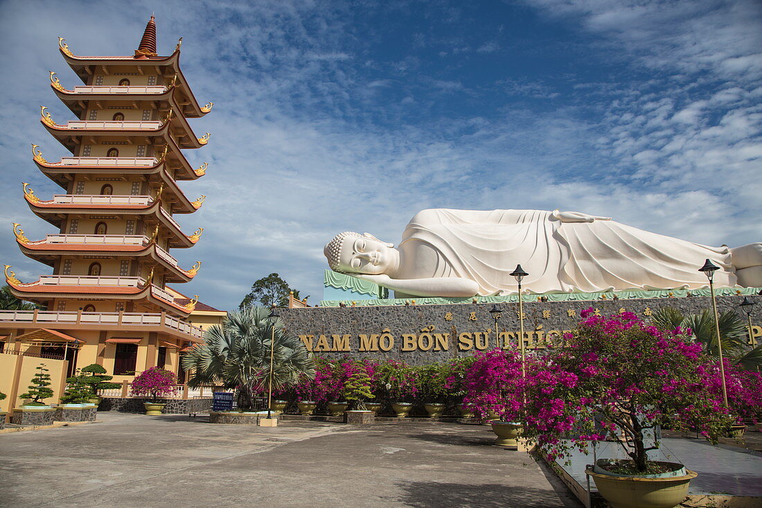 Giant reclining Buddha statue at the Vinh Trang Pagoda, My Tho, Tien Giang, Vietnam, Asia