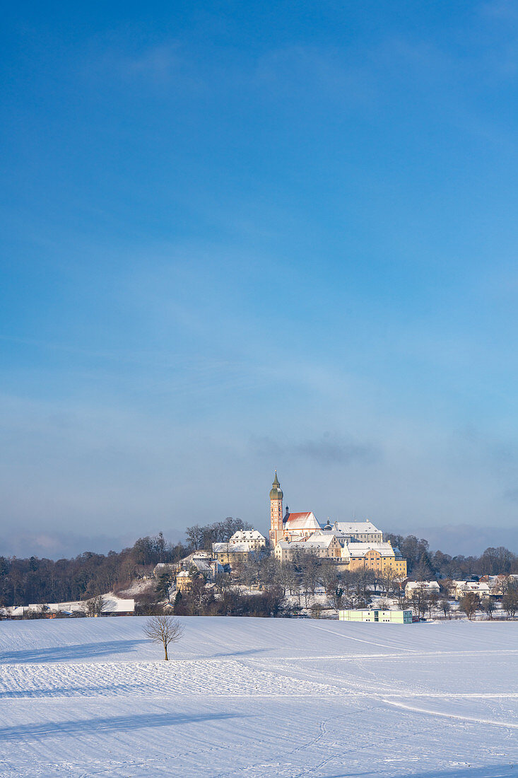 Andechs Monastery in a snowy winter landscape, Andechs, Bavaria, Germany.